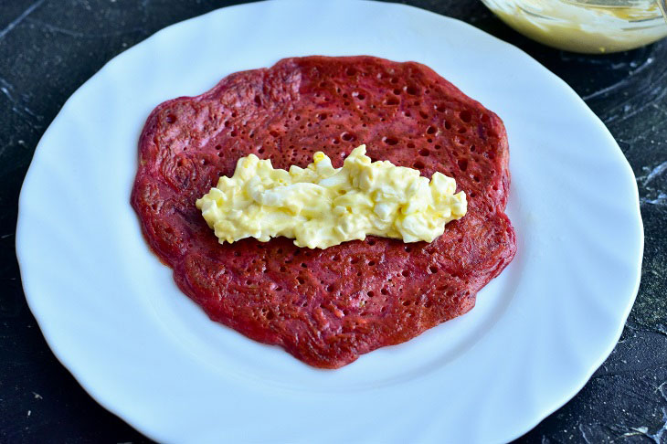 Rolls of beetroot pancakes - a wonderful snack on the festive table