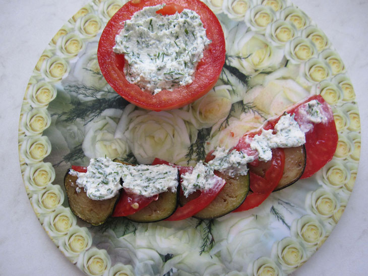 Beautiful appetizer of tomatoes with cottage cheese from a simple set of products