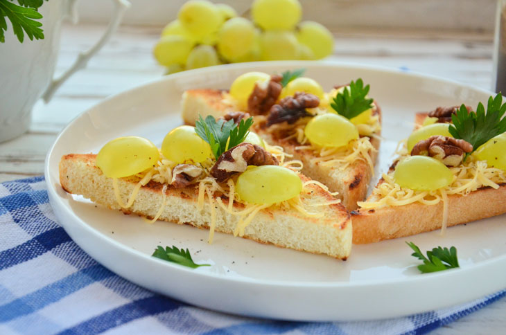 Bruschetta with grapes, nuts and cheese - a gourmet snack