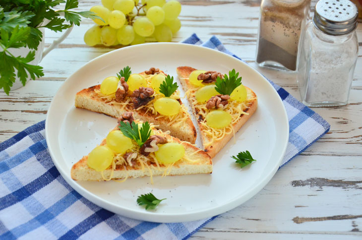 Bruschetta with grapes, nuts and cheese - a gourmet snack