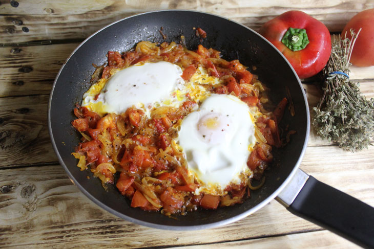 Israeli breakfast "Shakshuka" - fragrant scrambled eggs in tomato sauce