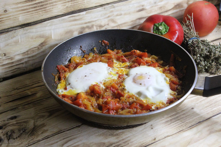 Israeli breakfast "Shakshuka" - fragrant scrambled eggs in tomato sauce