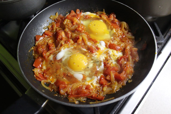 Israeli breakfast "Shakshuka" - fragrant scrambled eggs in tomato sauce