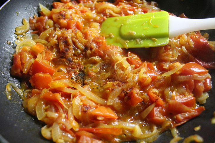 Israeli breakfast "Shakshuka" - fragrant scrambled eggs in tomato sauce