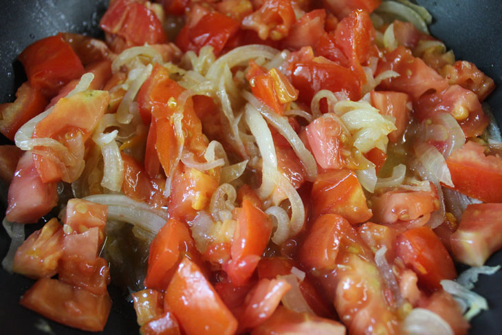 Israeli breakfast "Shakshuka" - fragrant scrambled eggs in tomato sauce