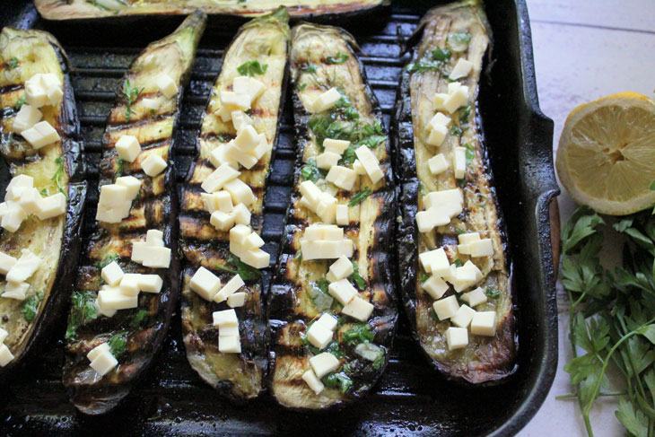 Delicious grilled eggplant with cheese and nuts