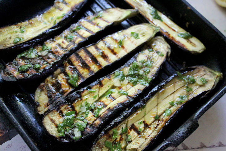 Delicious grilled eggplant with cheese and nuts