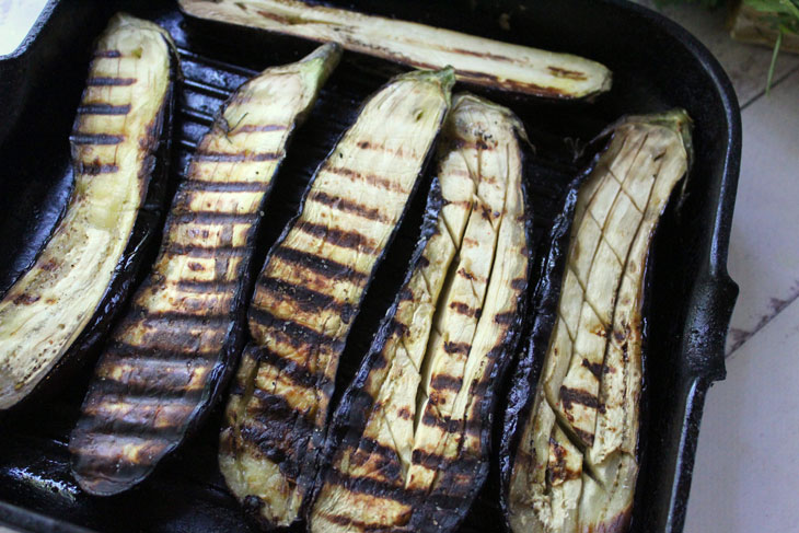 Delicious grilled eggplant with cheese and nuts