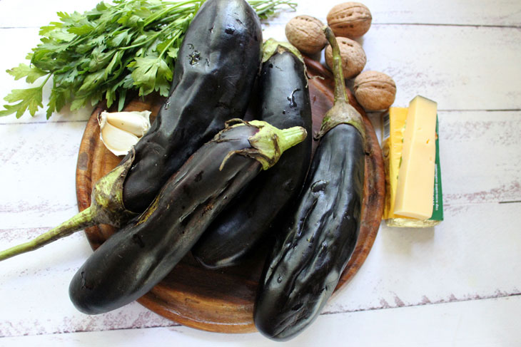 Delicious grilled eggplant with cheese and nuts