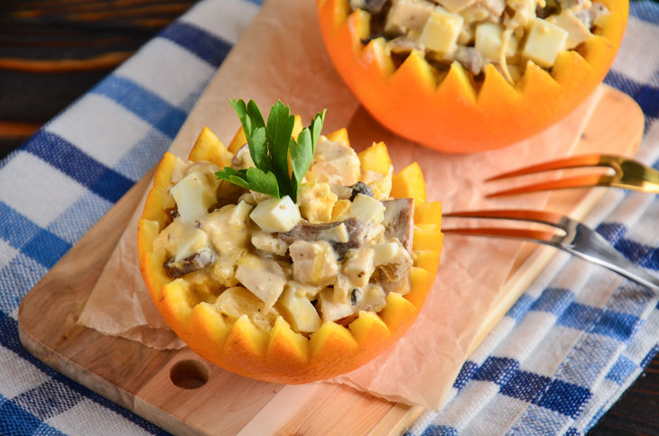 Salad in orange with chicken and mushrooms - perfect for a festive table