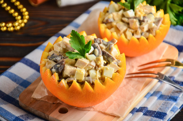 Salad in orange with chicken and mushrooms - perfect for a festive table