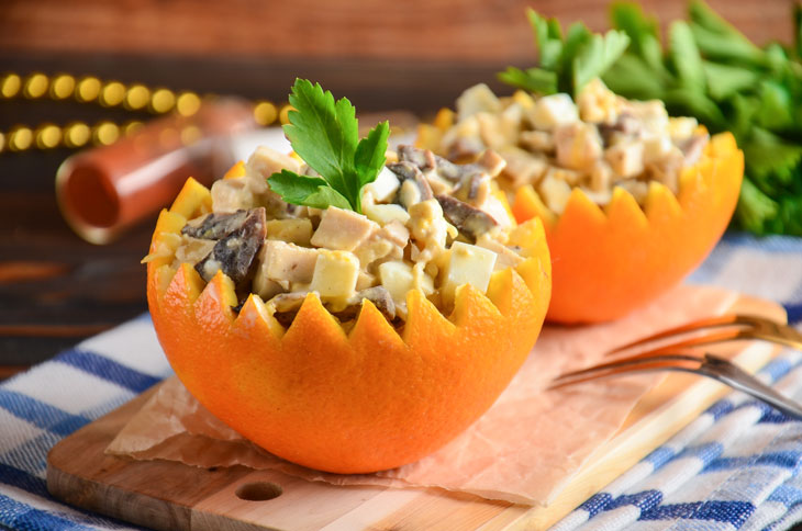 Salad in orange with chicken and mushrooms - perfect for a festive table