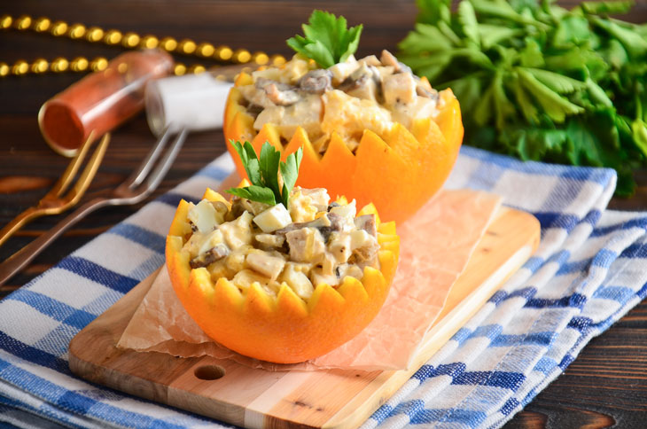 Salad in orange with chicken and mushrooms - perfect for a festive table