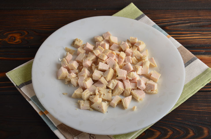 Salad in orange with chicken and mushrooms - perfect for a festive table