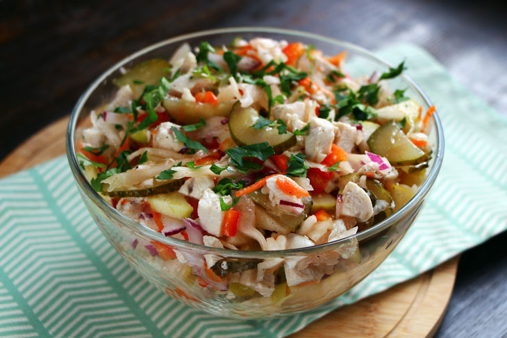 Winter salad with chicken, sauerkraut and apple