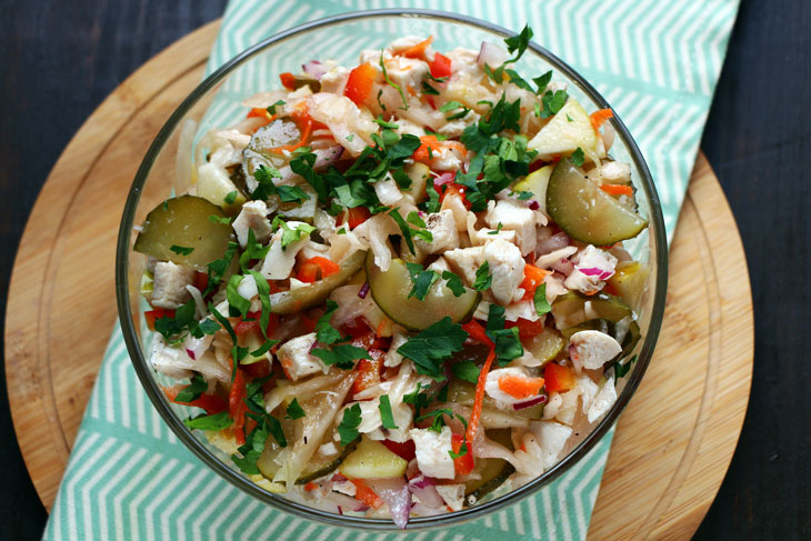 Winter salad with chicken, sauerkraut and apple