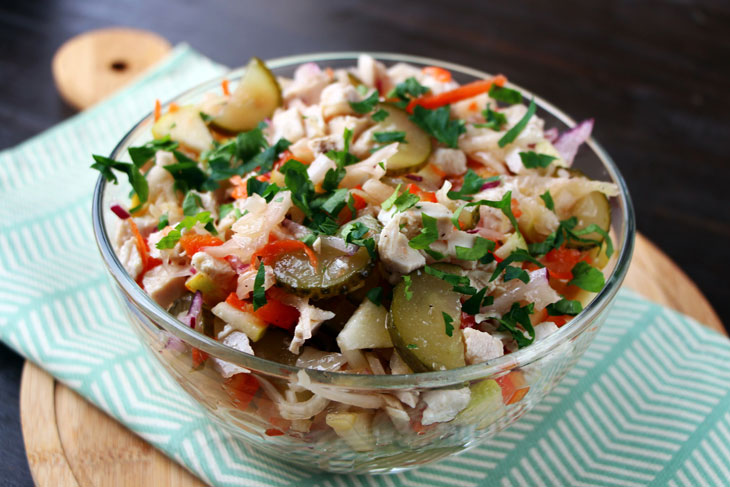 Winter salad with chicken, sauerkraut and apple