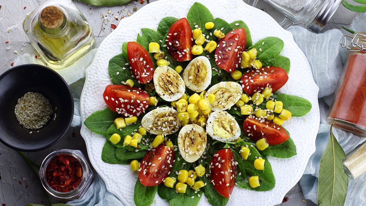 Salad “Flower” with tomatoes and quail eggs is a decoration for any table