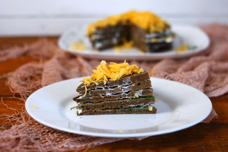 Liver cake with sour cream and hard cheese