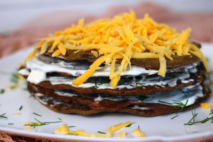 Liver cake with sour cream and hard cheese