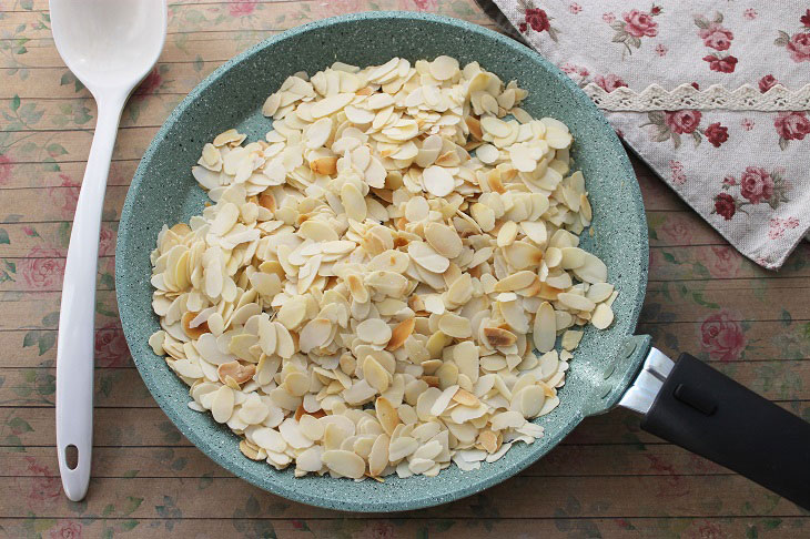 Cake "Honey" with almond petals - festive and delicious